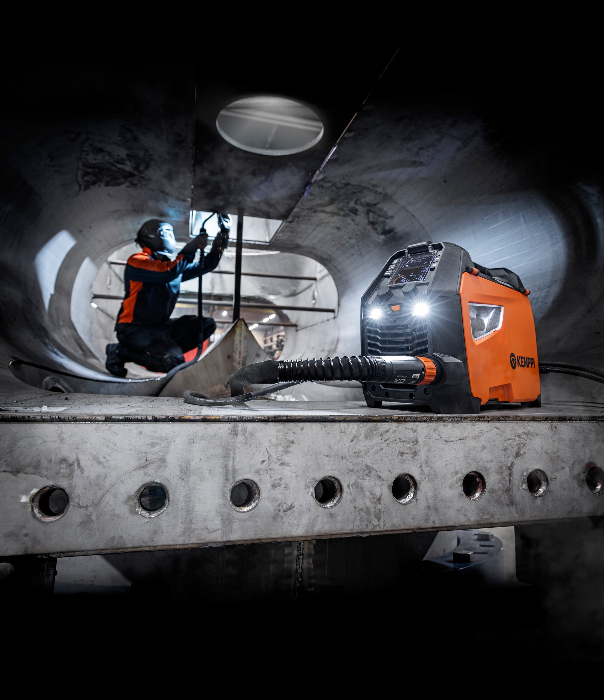 A welder welding in a ship