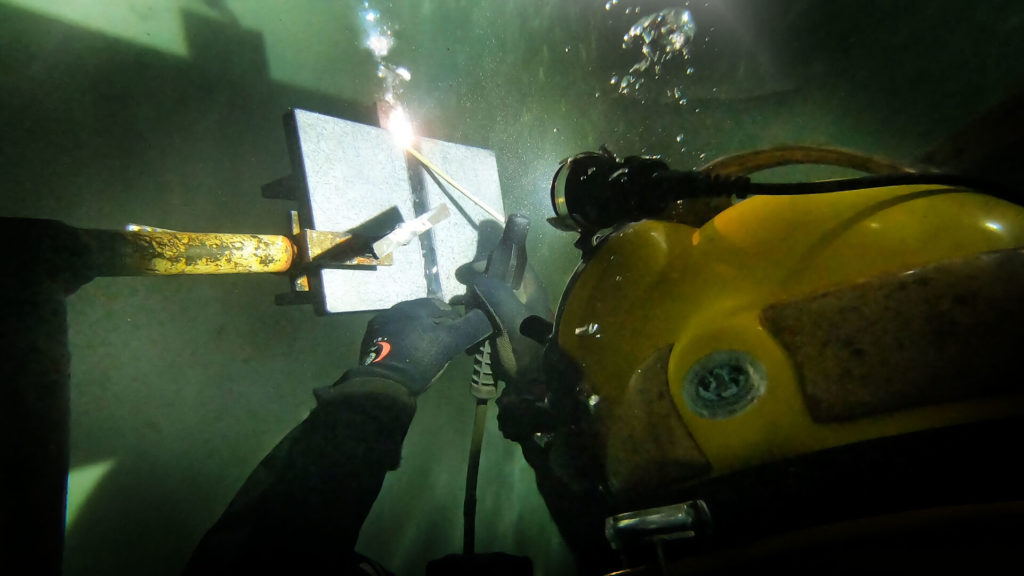 A welder welding under water