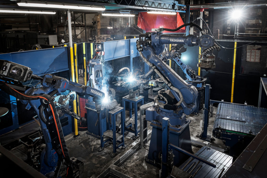 Smoothly integrating a welding power source into a robotic welding system