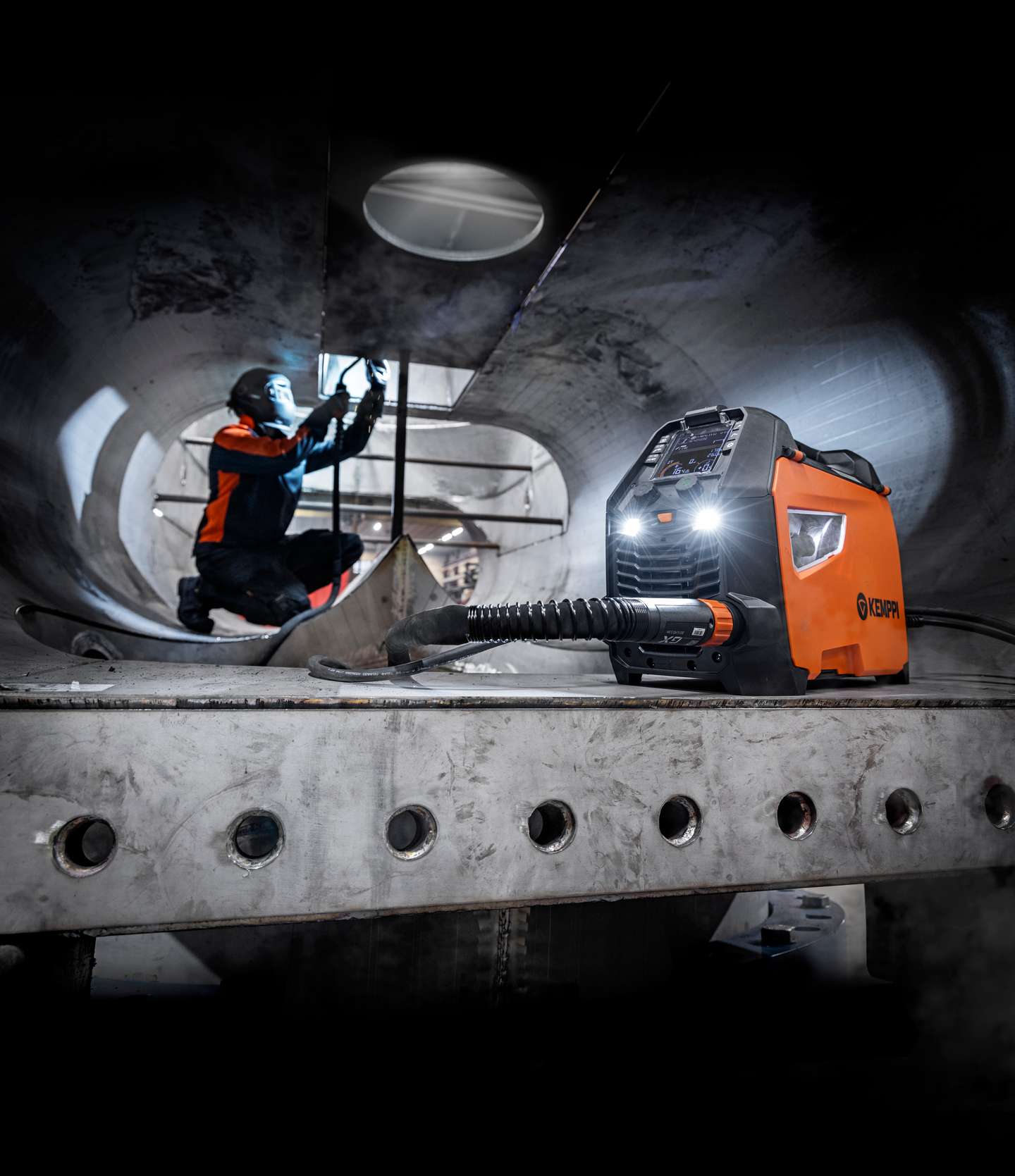 A welder welding in a ship